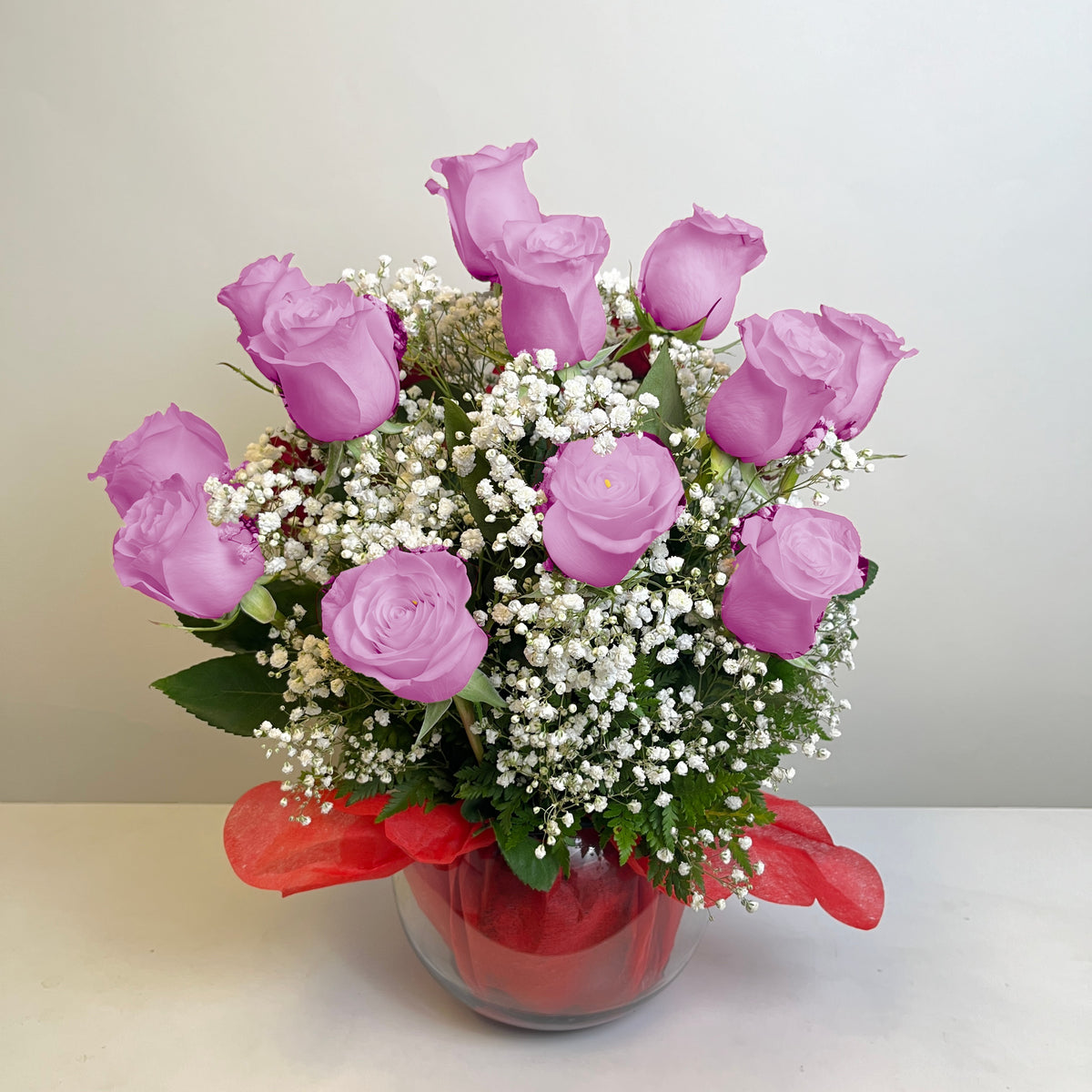 Arreglo de 20 rosas en pecera grande, rosas lila