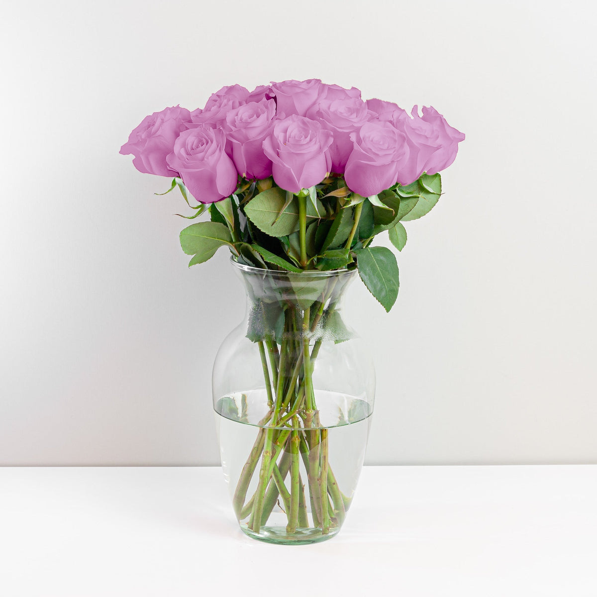 Arreglo con 15 rosas en base samaritano, rosas lila